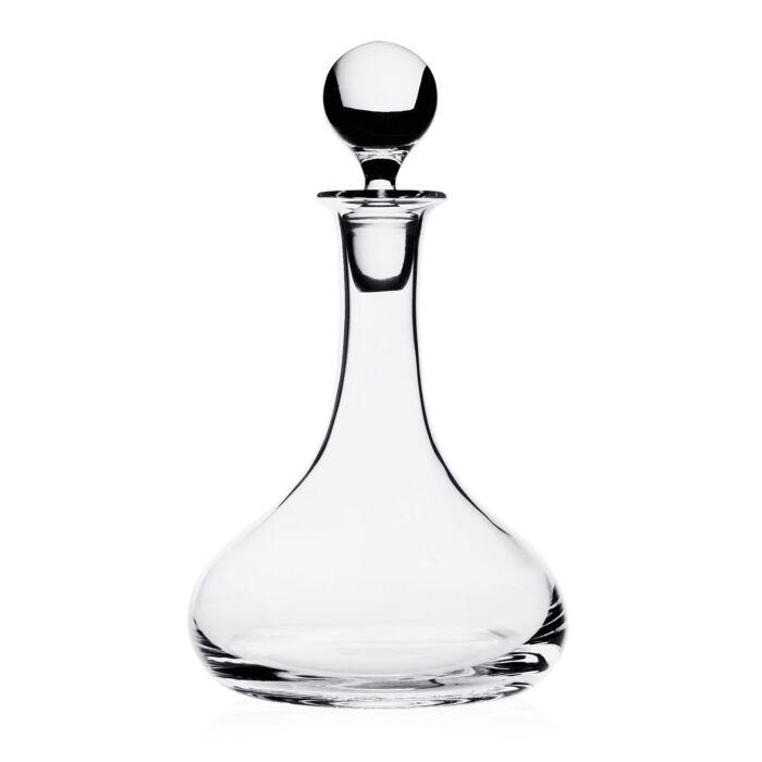 Clear glass decanter with a spherical stopper on a white background