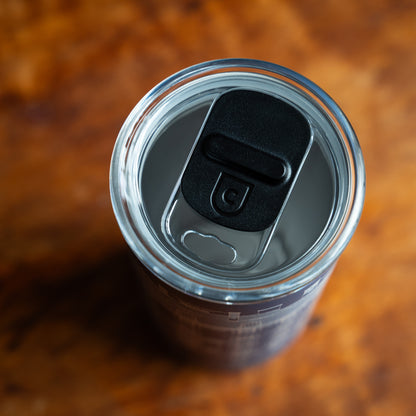 View of the wop of a tumbler with a clear plastic lid