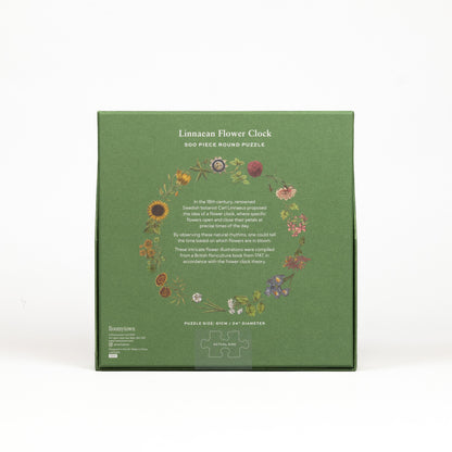Green box of a 500-piece round puzzle titled 'Linnaean Flower Clock' on a white background