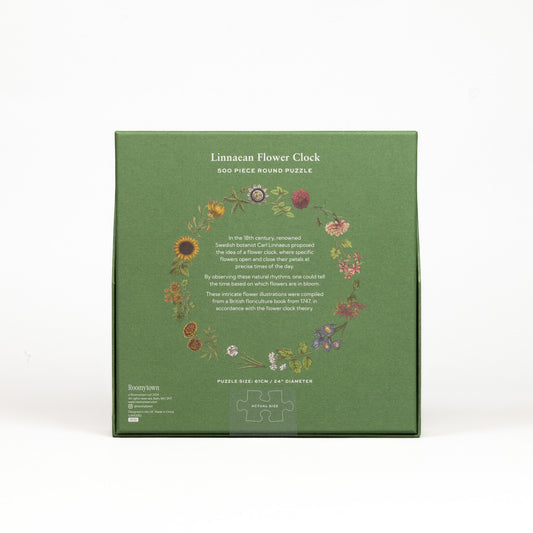 Green box of a 500-piece round puzzle titled 'Linnaean Flower Clock' on a white background