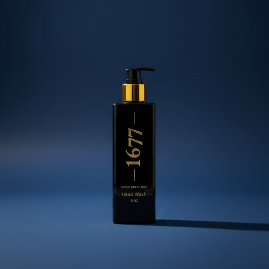 'GENTLEMEN 1677 HAND WASH 8 oz' in a black and gold pump bottle against a navy blue background