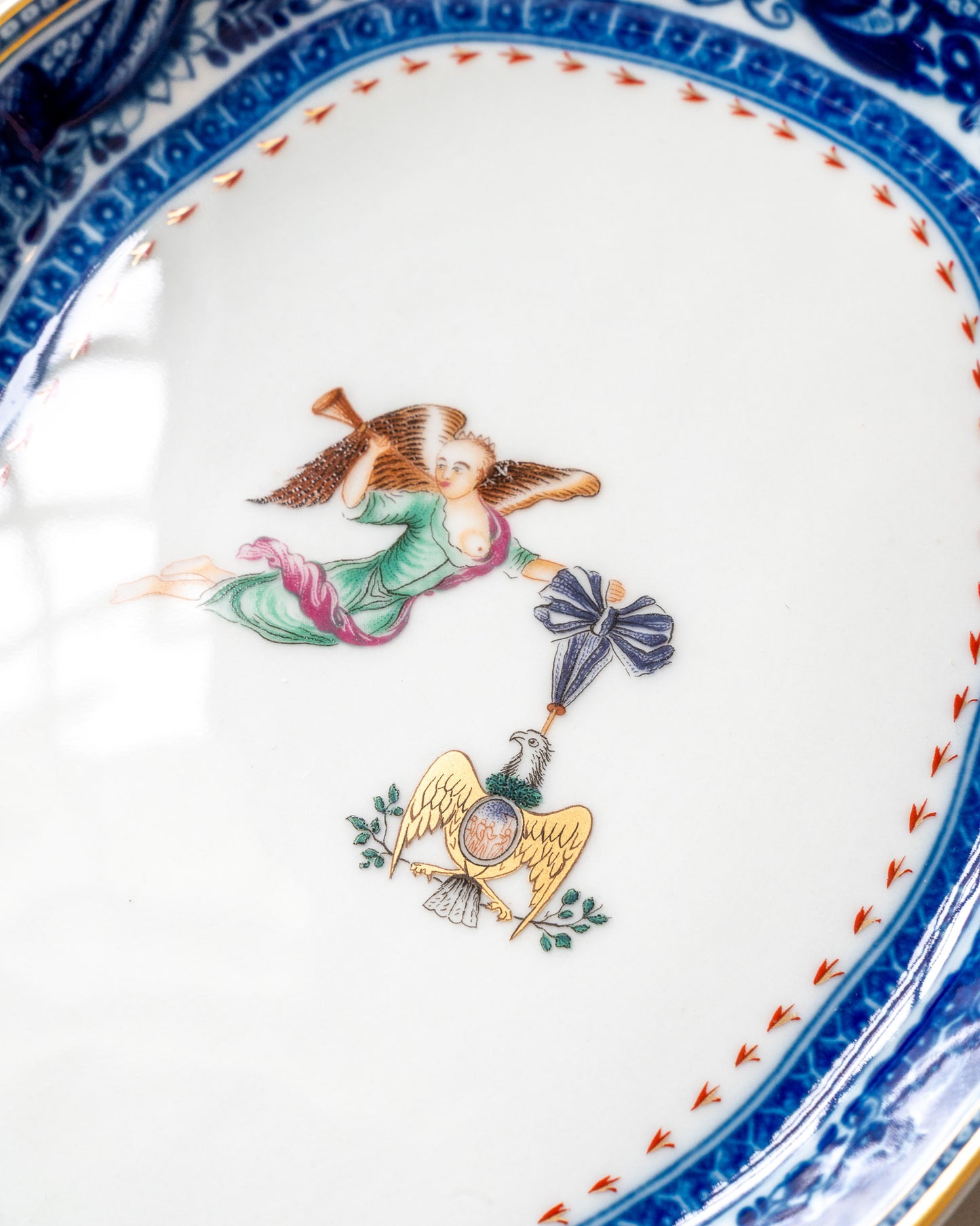 Decorative plate with angel and eagle central design 