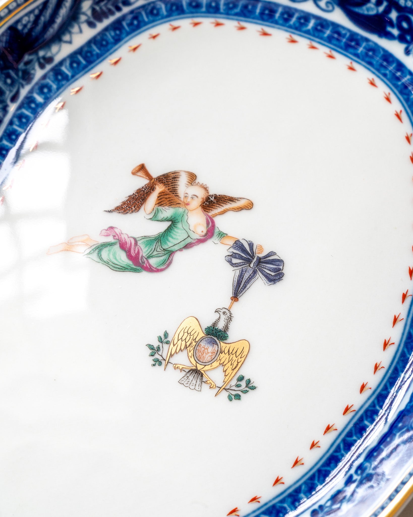Decorative plate with angel and eagle central design 