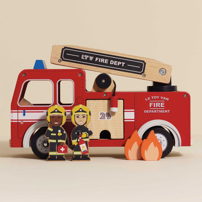 Wooden toy fire truck set with firefighters and flames on a beige background