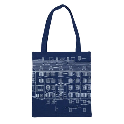 Navy blue canvas tote bag featuring an architectural line drawing of a house in white with the words 'WEST ELEVATION'