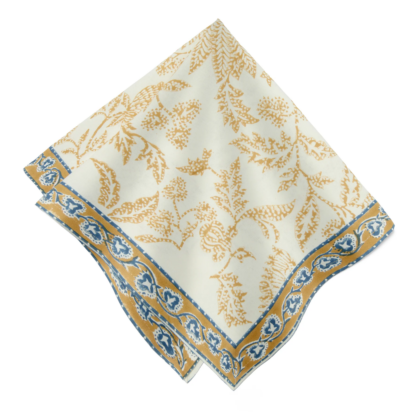 A folded cream-colored cotton napkin featuring a block-printed floral pattern in a muted deep mustard and blue shown against a white background.