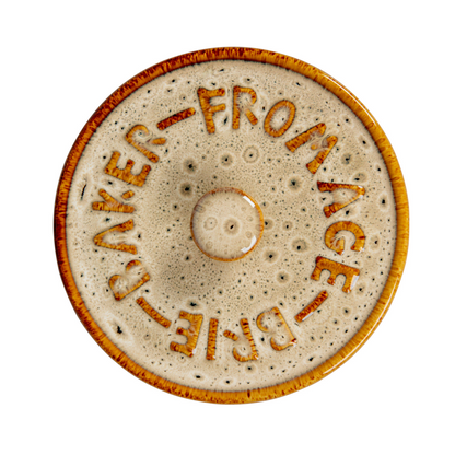Top view of beige and brown speckled stoneware lid with the raised words 'FROMAGE-BRIE-BAKER' 