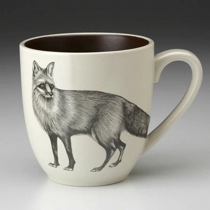 An off-white stoneware tapered mug featuring a sketch of red fox in black and  a dark brown interior.