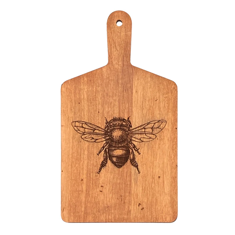 Rectangular wooden cutting board with an engraved honeybee design