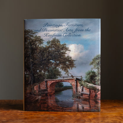 Book cover featuring the title Paintings, Furniture and Decorative Arts from the Kaufman Collection and a painting of a bridge over a river
