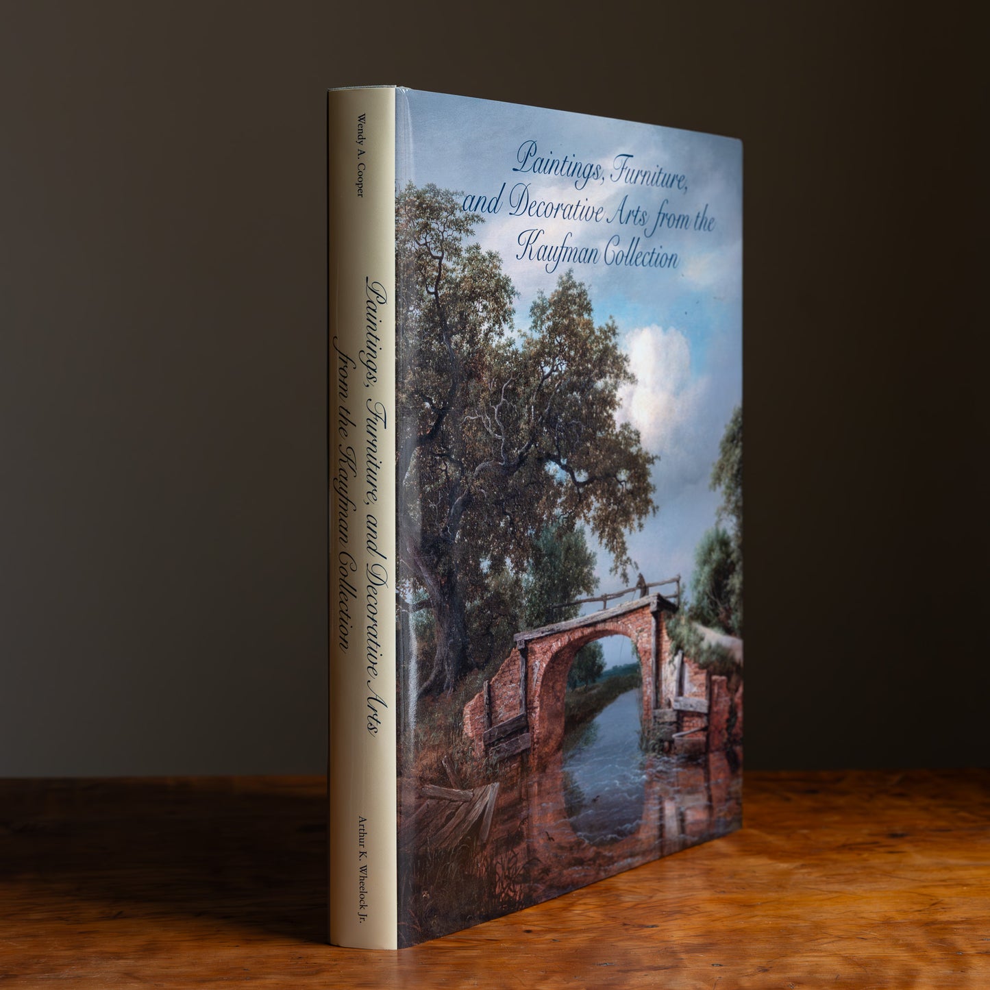 Book with tan spine titled 'Paintings, Furniture and Decorative Arts from the Kaufman Collection' 