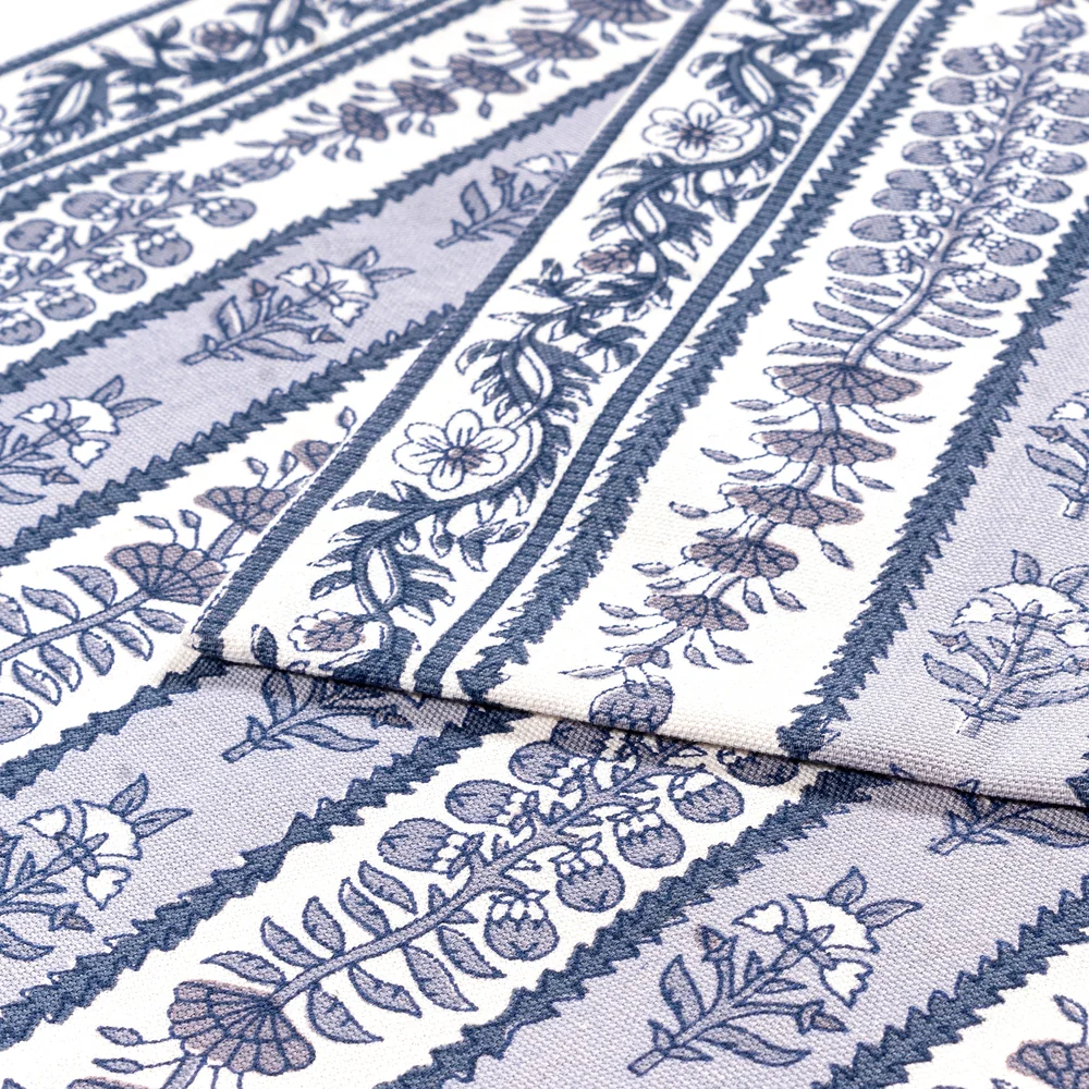 Close-up of a folded blue and white block printed table runner