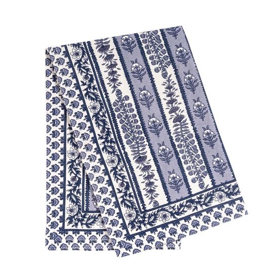 A folded cotton tea towel featuring a classic Indian floral block print pattern in navy blue and light blue on off-white.