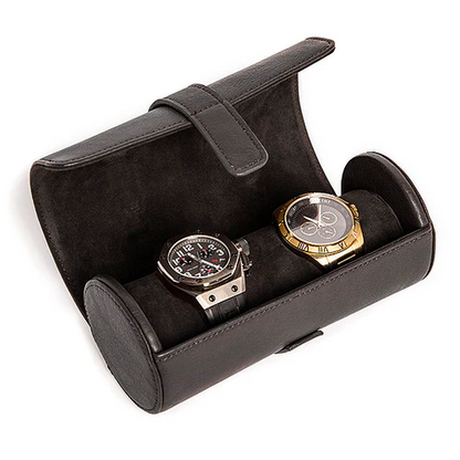 Two wrist watches inside a black faux-leather case against a white background