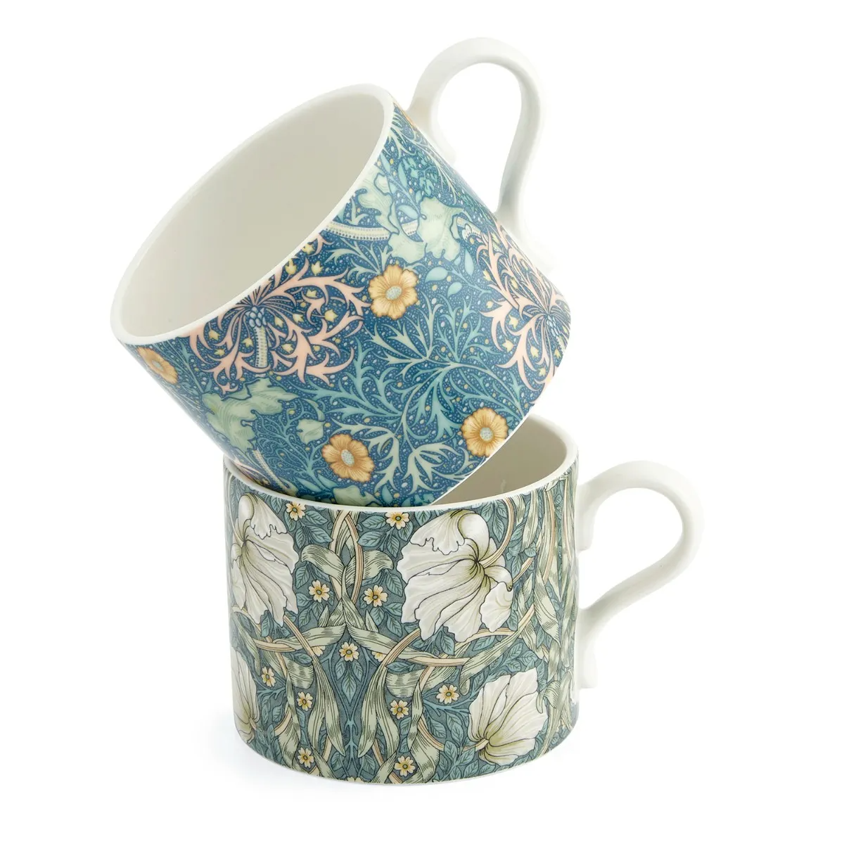 Two William Morris floral-patterned mugs in shades of blues, greens and yellows stacked on a white background
