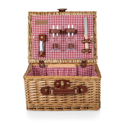 Wicker picnic with a red and white gingham interior and brown leather trim. Set includes two wine cups, wine bottle opener, cheese board, and cheese knife.
