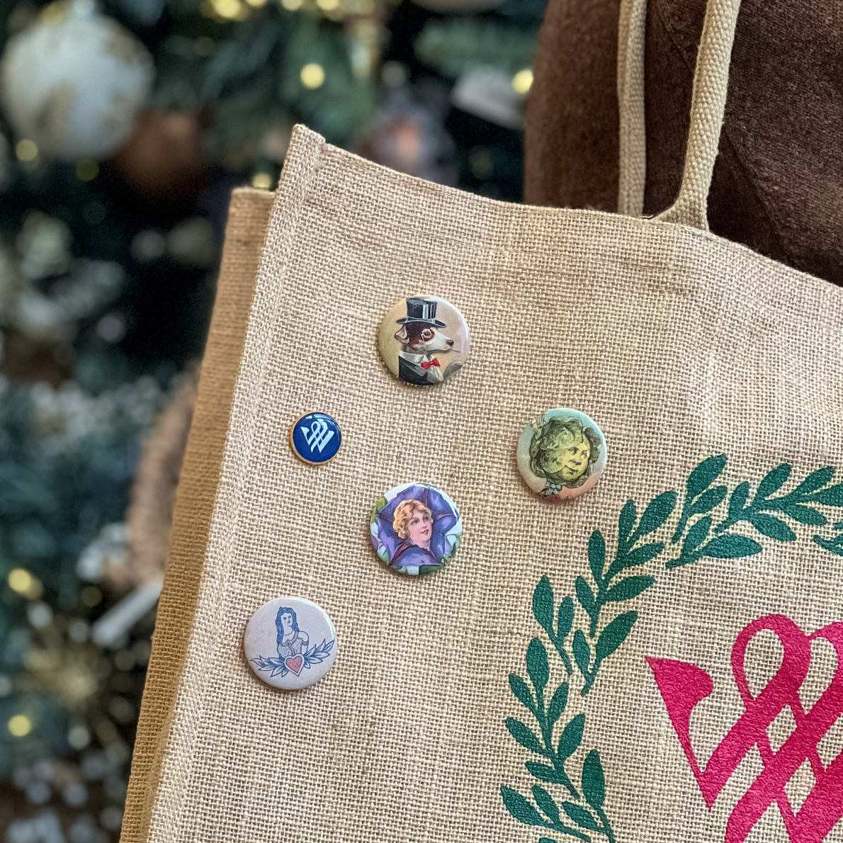 Winterthur pins attached to a branded jute tote bag.
