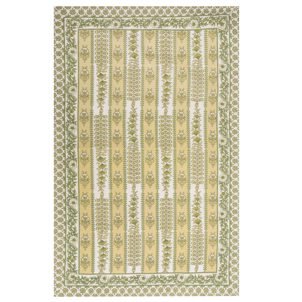 A rectangular tea towel with a block printed floral pattern in green and yellow, featuring horizontal bands of ornate motifs and a decorative border.