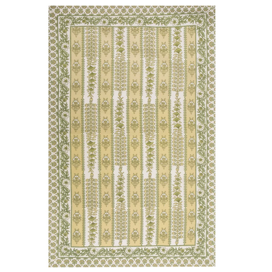 A rectangular tea towel with a block printed floral pattern in green and yellow, featuring horizontal bands of ornate motifs and a decorative border.