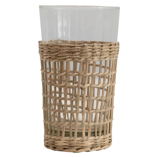 Clear glass drinking cup with a woven seagrass sleeve