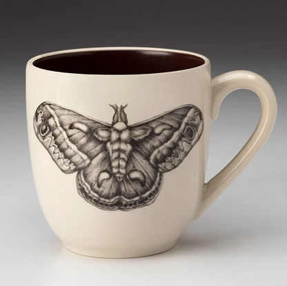 An off-white stoneware tapered mug featuring a sketch of silk moth in black and a dark brown interior.