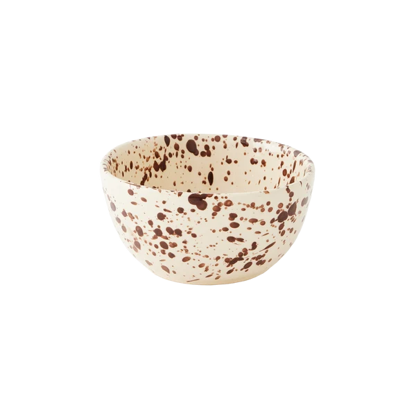 Round ceramic bowl with a cream-colored base decorated with a translucent brown splattered pattern on a white background