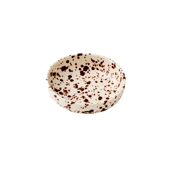 A small round ceramic bowl with a cream-colored base decorated with a translucent brown splattered pattern on a white background