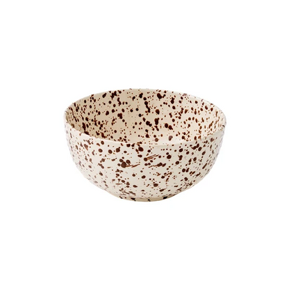 A large round bowl with a cream-colored base decorated with a translucent brown splattered pattern on a white background