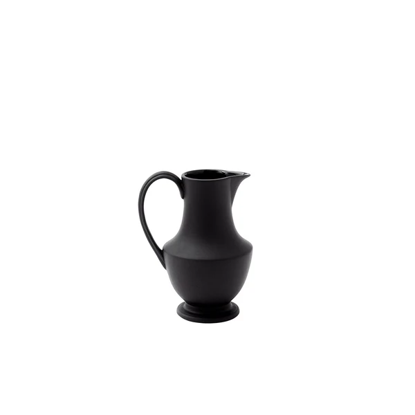 Matte black ceramic pitcher on a white background